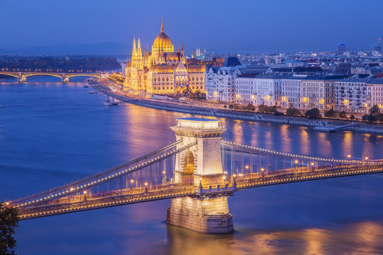 Budapest city night scene. View at  Budapest Chain bridge( Sz&eacute;chenyi L&aacute;nch&iacute;d original name) , river Danube and famous building of Parliament. Budapest city is capital of east european country Hungary.