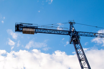 Construction site with cranes on sky background