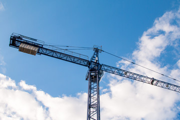 Construction site with cranes on sky background