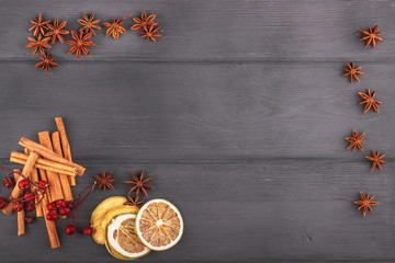 Christmas decoration with star anise, cinnamon stick in frame wi