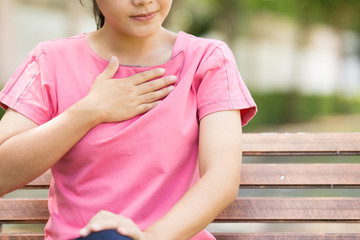 Woman has reflux acids in the garden