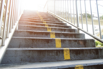 overpass concrete staircase with metal hand rail