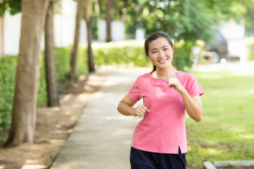 Woman run at the garden