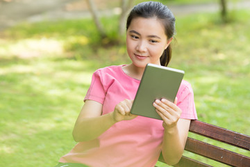 Fototapeta premium Woman use tablet in the garden