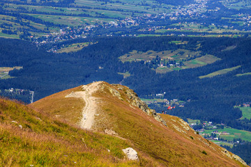 A wounded hiker is being rescued by helicopter in the Tatra mountains, Poland.