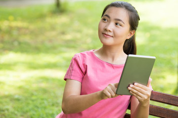 Fototapeta premium Woman use tablet in the garden