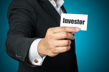 businessman holding investor card