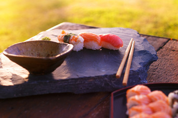 Japanese sushi on black stone outdoor