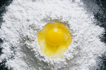 Egg in the center of flour pile
