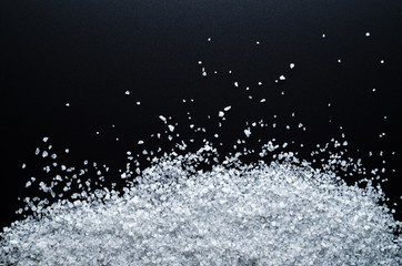 Large Sea Salt (As Snow) On A Black Background. Close-Up. Top View.