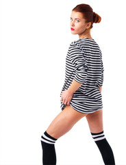 Beautiful slim naked woman isolated on white. Stripes t-shirt