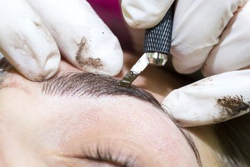 Naklejka premium Mikrobleyding eyebrows workflow in a beauty salon