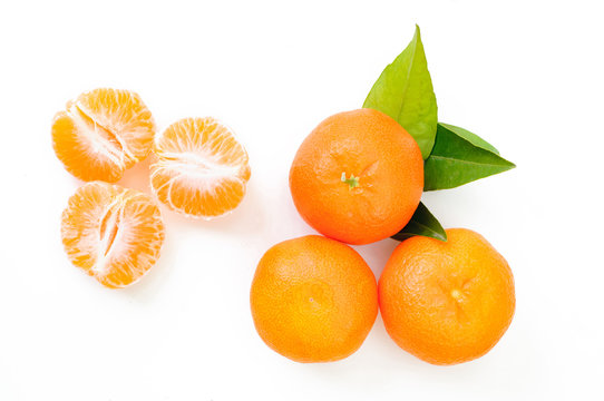 tangerine with separated segments on white background