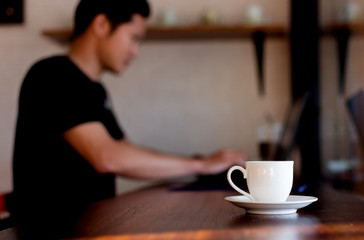 Cup of coffee on table in the room.