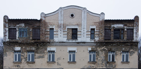 decrepit facade of the high-rise building requires repairs