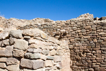Sandstone walls and blue sky at an abandoned Pueblo site in Aztec, NM