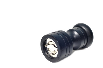 Black pepper grinder bottle on white background.