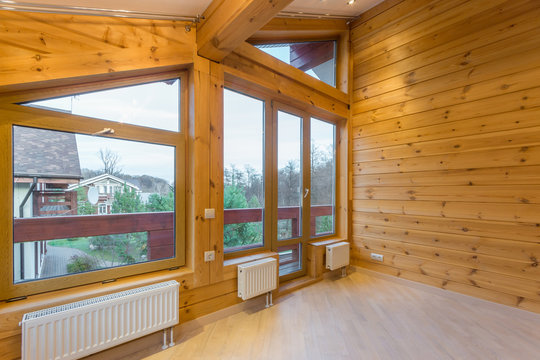 Large empty room in a new wooden house