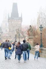Prague, Czechia - November, 21, 2016: crowd of people on Charles Bridge in Prague, Czechia