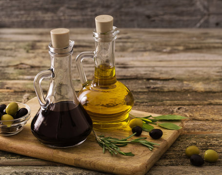 olive oil and balsamic vinegar on a wooden background