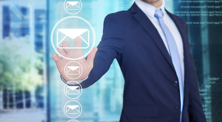 Businessman touching technology interface with professional emai