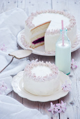White cake with pink flowers