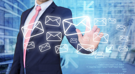 Businessman touching technology interface with email icons