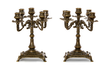 Two vintage bronze candle holder on a white background