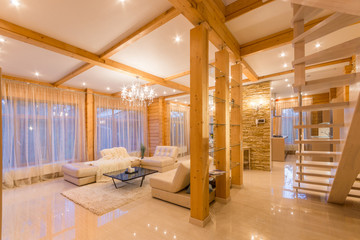 Large bright new living room with staircase