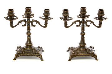 Two vintage bronze candle holder on a white background