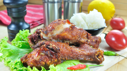 Fried chicken with seasoning set up on table, food stylist