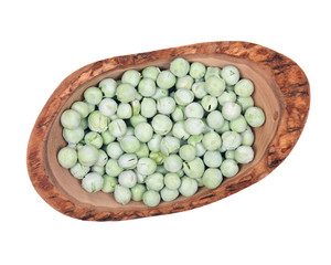 Natural crunchy dried peas in olive wood bowl isolated on white background