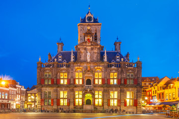 Fototapeta na wymiar City Hall on the Markt square in the center of the old city at night, Delft, Holland, Netherlands