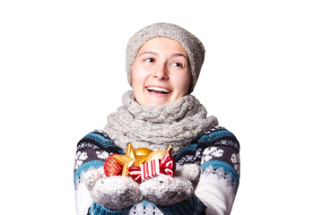 Young girl holding a Christmas toys,decorations. copyspace