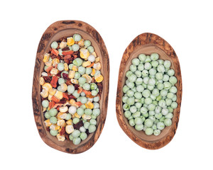 Natural crunchy dried veggies in olive wood bowl isolated on white background