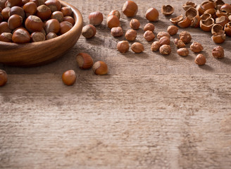 Hazelnuts on wooden background