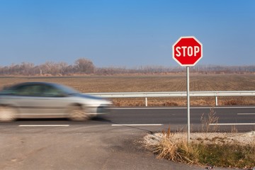 Stop Sign at Crossroads. Roads in the Slovak countryside. Exit onto the main road. Main road....