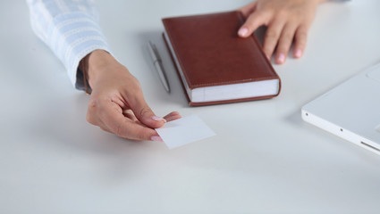 Woman Hand showing a blank business card