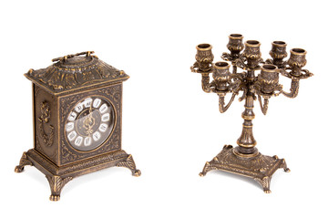 Vintage bronze candle holder and clock on a white background