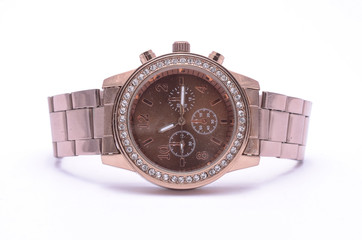 Copper wrist watch with gems isolated on white
