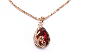 gold pendant with ruby isolated on white