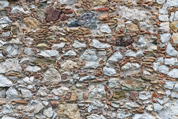 Background texture of wall with several kinds of stones