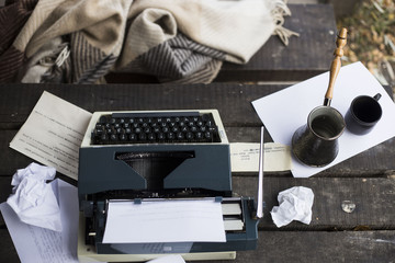 
woman typing on a typewriter