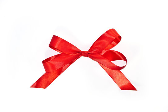  Red bow from ribbon with tails isolated