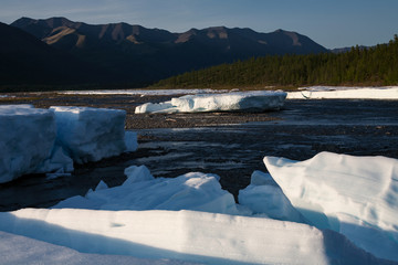 Remnants of ice in the river valley. River Eyemyu. Moma Mountains. Yakutia. Russia.