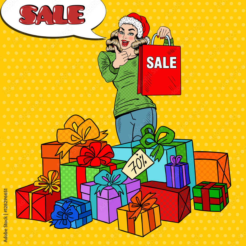 Wall mural Pop Art Happy Woman in Santa Hat with Shopping Bag and Huge Gift Boxes on Christmas Sale. Vector illustration