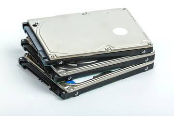 Three 2.5 inch laptop hard disk drives lie on each other. Isolated on white background.