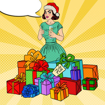 Pop Art Happy Woman in Santa Hat with Big Gift Boxes and Champagne Glass. Vector illustration