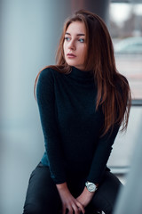 Stylish girl on background of modern airport.