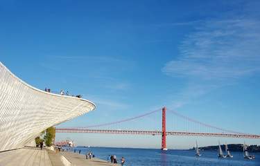 Landscape of the Tagus River with 25 abril bridge in the distanc